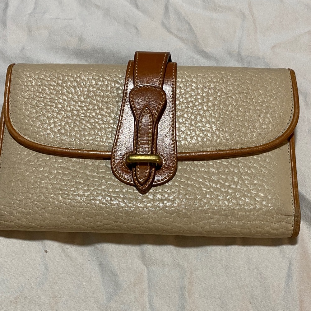 Dooney & Bourke Cream Pebbled Leather Clutch with Tan Trim